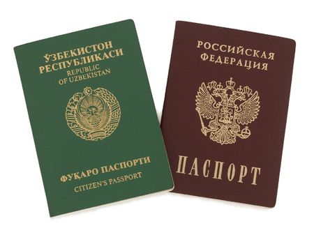 Uzbekistan and Russian passports. Isolated on white.の写真素材