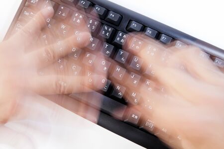 Businessman typing very fast on a laptop keyboard, isolated on white background