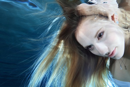 Young woman underwaterの写真素材