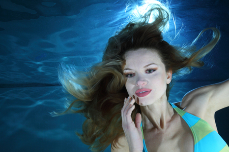 Woman underwater in the poolの写真素材
