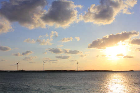 The setting sun and a windmill