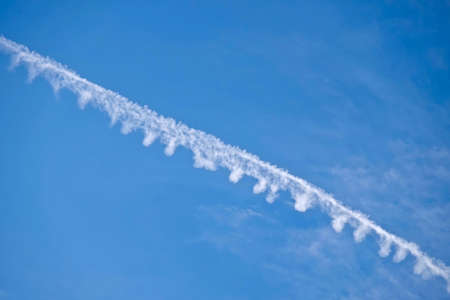 Simple Air Plane Trace on Clear Blue Sky. Grand Straircase Escalante National park, Utah State, USA.