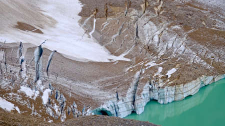 Glacier close up view and its reflection in tarn lake. Candian Rocky Mountains. Alberta. Canada.の写真素材