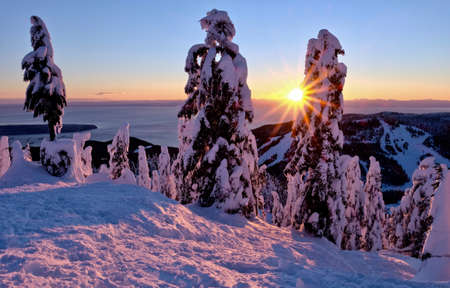 Sunset over ski slopes on Cypress Mountain Porvincial Park. North Vancouver. British Columbia. Canada.の写真素材