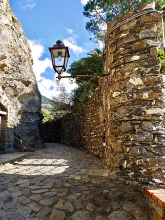 Street lamp on stone wall in Cinque Terre National Park.  Monterosso al Mare.  Italyの写真素材