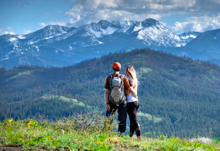 Happy friends hipsters  hiking in mountains. North Cascades  National Park. Cascade Mountains. Winthrop.  Washington. The United States.の写真素材