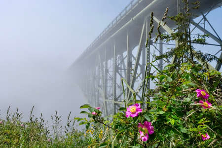 Deception Pass Bridge in fog. Arch bridge. Deception Pass State Park. Puget Sound. Juan de Fuca Strait. Whidbey Island. Seattle. Washington. United States.の写真素材