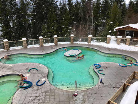 HALCYON HOT SPRINGS, BRITISH COLUMBIA/ CANADA - DECEMBER 26, 2016: People relaxing in 37 degrees Celsius mineral pool.のeditorial素材