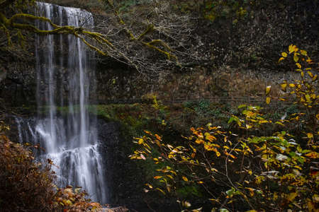 Behind the waterfalls hiking trail in Oregon. Salem. Autumn landscape in  Pacific Northwest. United...