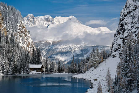 Tea House at Lake Agnes in mountains covered with snow by blue alpine lake. Lake Louise area in Banff National Park. Canadian Rockies. Alberta. Canada Tea House at Lake Agnes in mountains covered with snow by blue alpine lake. Lake Louise area in Banff National Park. Canadian Rockies. Alberta. Canada