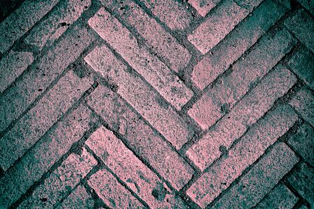 Old block pavement, fragment, texture background, pink and turquoise colorsの写真素材