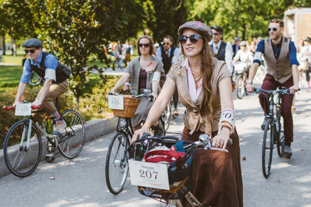 Toronto, Canada - September 20, 2014: Unidentified participants of Tweed Ride Toronto riding on their bicycles. This annual event also known as Tweed Run is dedicated to the style of old England: people dress up in vintage style clothes and try to reconstのeditorial素材