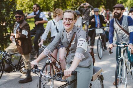 Toronto, Canada - September 20, 2014: Unidentified participants of Tweed Ride Toronto riding on their bicycles. This annual event also known as Tweed Run is dedicated to the style of old England: people dress up in vintage style clothes and try to reconstのeditorial素材
