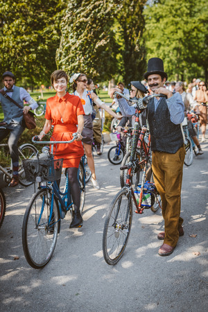 Toronto, Canada - September 20, 2014: Unidentified participants of Tweed Ride Toronto riding on their bicycles. This annual event also known as Tweed Run is dedicated to the style of old England: people dress up in vintage style clothes and try to reconstのeditorial素材