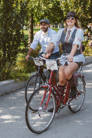 Toronto, Canada - September 20, 2014: Unidentified participants of Tweed Ride Toronto riding on their bicycles. This annual event also known as Tweed Run is dedicated to the style of old England: people dress up in vintage style clothes and try to reconstのeditorial素材
