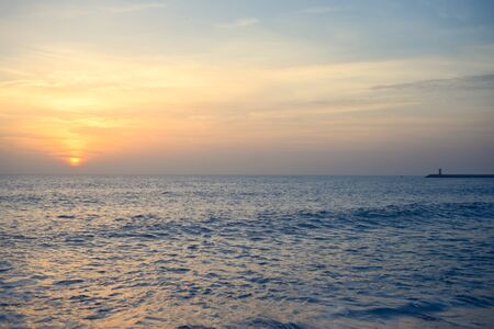 Beautiful sunset over sunny ocean backgroundの写真素材