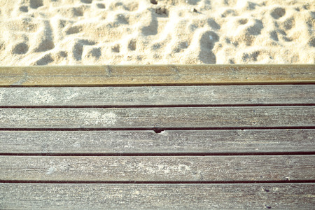 Sunny summer day with wooden walkway on sandy beach backgroundの写真素材