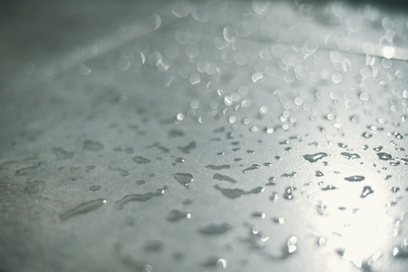 Water drops over stone texture background. Copy space photographyの写真素材