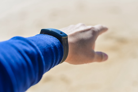 Finger pointing forward on outdoors background sunny dayの写真素材