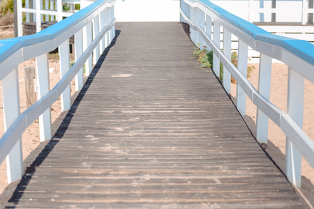 Wooden bridge or boardwalk on beachの写真素材
