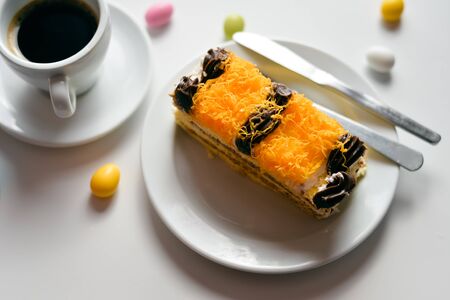 Coffee and cake on light table, closeup top view flat lay styleの写真素材