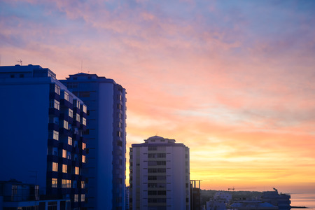 Modern buildings over dawn sky. City and sunrise sunset outdoors background