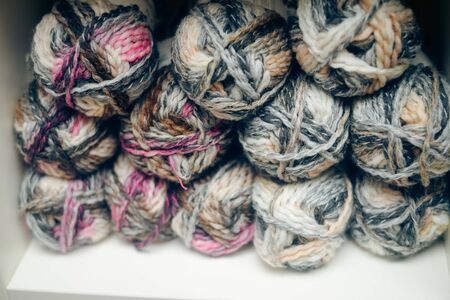 Knitting yarn on shelf, closeup photoの写真素材