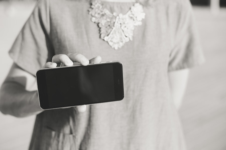 Beautiful young lady using smartphoneの写真素材