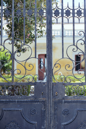 Closeup detailt of beautiful old ornate metal door outdoors backgroundの写真素材