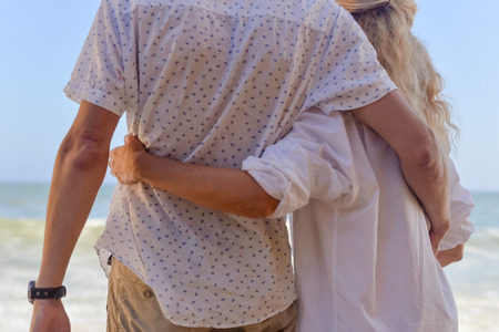 Happy couple holding hands together hugging, close up viewの写真素材