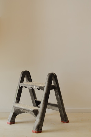 Ladder and home property improvement concept, light wall backgroundの写真素材
