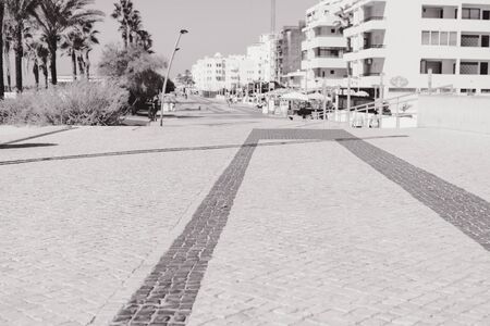 Top view on road or pavement made of natural stone, outdoors backgroundの写真素材