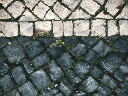 Textured natural stone pavement surface backgroundの写真素材