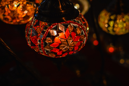 Colorful blurry shiny background of illuminated beautiful lighting lamps, closeup viewの写真素材