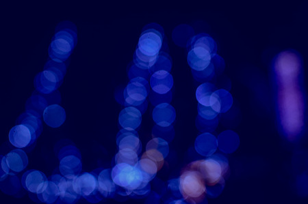 Blurry bokeh light background festive city evening outdoors illumination