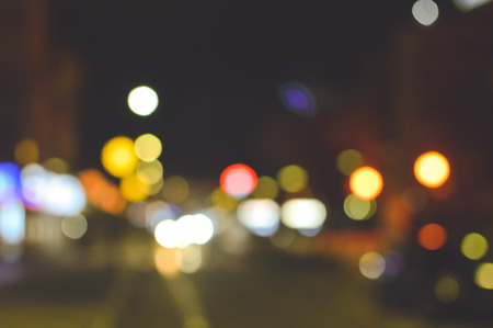 Blurry bokeh light background festive city evening outdoors illumination