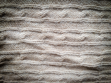 Beautiful crafted gray wool knitted background, natural soft surfaceの写真素材