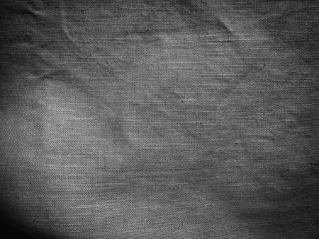 Black natural linen fabric abstract space background surfaceの写真素材