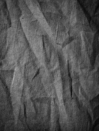 Black natural linen fabric abstract space background surfaceの写真素材