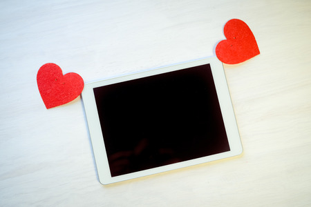Tablet PC Computer and Love Heart. Happy Emotional Celebration, Lovely Atmosphere Backgroundの写真素材