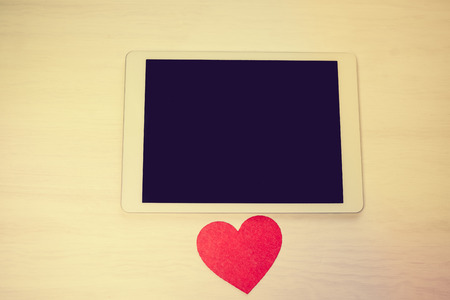 Tablet PC Computer and Love Heart. Happy Emotional Celebration, Lovely Atmosphere Backgroundの写真素材