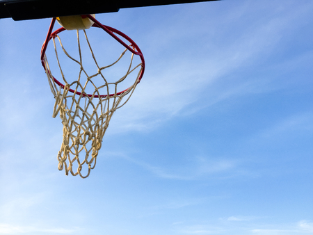 Sport playground with basketball ring on blue sky outdoors background