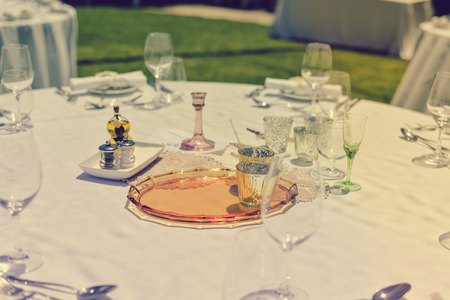 Decorated celebrating event table on sunny day outdoors backgroundの写真素材