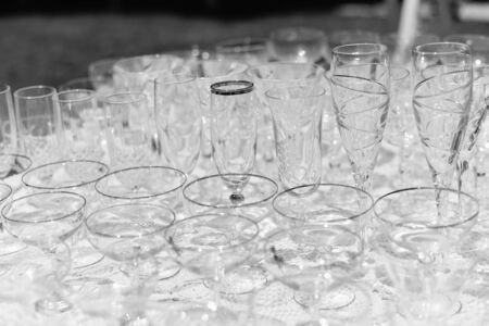 Empty glasses for party celebration event on light background. Closeup imageの写真素材