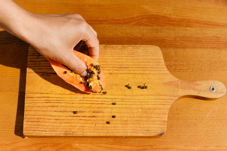 Sliced fruit fresh papaya on white plate. Top view flat lay styleの写真素材