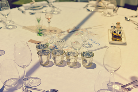 Elegant arrangement table setting for special event celebrating on outdoors backgroundの写真素材