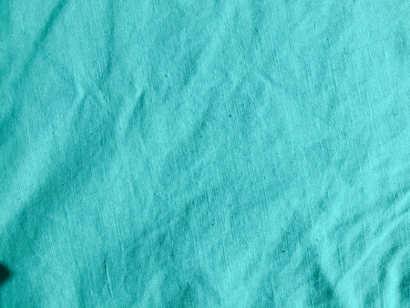Closeup on texture of natural linen fabric backgroundの写真素材