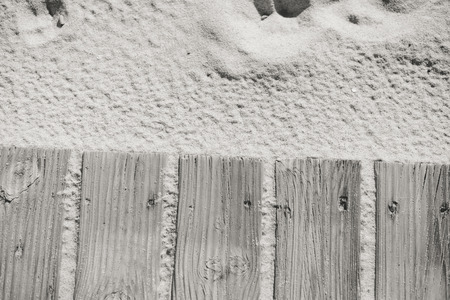 Closeup on weathered wooden boardwalk on sand dune outdoors background. Natural decorative textureの写真素材