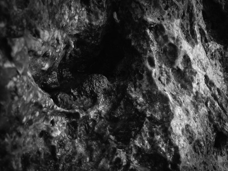 Natural black rock stone surface granite abstract backdrop textured backgroundの写真素材