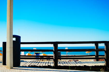 Beautiful sunny holiday travel seascape, wooden bridge on sandy beach outdoors tranquility backgroundの写真素材